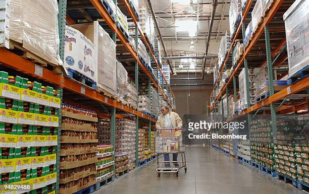 Alan Cater walks down the aisle inside a Costco store in Arvada, Colorado on Friday, December 9, 2005. Sales at U.S. Wholesalers rose 1.2 percent in...