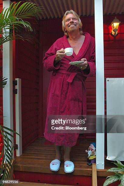 Virgin Group Chairman Sir Richard Branson stands in a bath robe and slippers during a media launch in Sydney, Australia Monday, March 6, 2006....