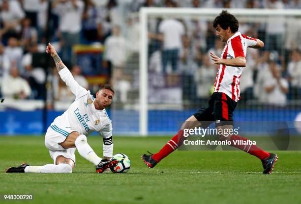 Sergio Ramos of Real Madrid fight the ball with Mikel San Jose during the La Liga match between Real Madrid and Athletic Club at Estadio Santiago...