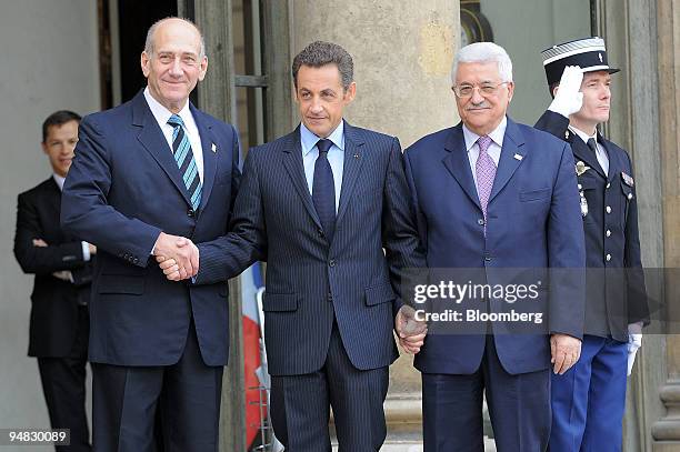 Nicolas Sarkozy, France's president, center, greets Mahmoud Abbas, president of the Palestinian Authority, right, and Ehud Olmert, Israel's prime...