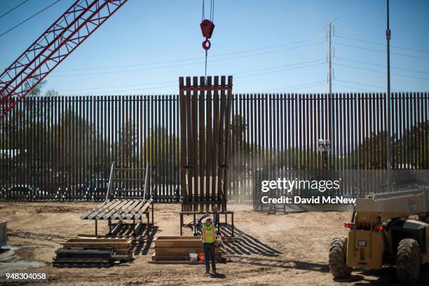 Construction of a new fence takes place as U.S. Department of Homeland Security Secretary Kirstjen M. Nielsen tours a replacement border fence...