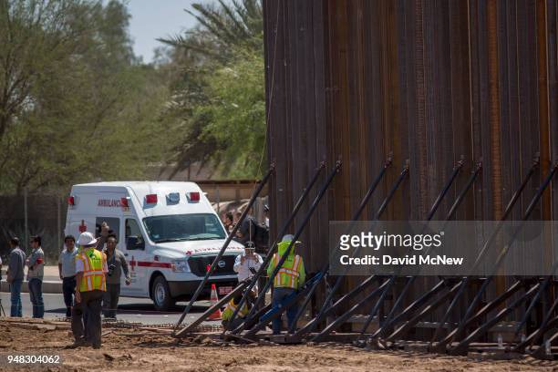 An ambulance on the Mexican side of the border passes as U.S. Department of Homeland Security Secretary Kirstjen M. Nielsen tours a replacement...