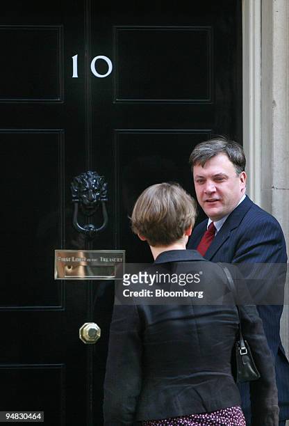 Ed Balls, U.K. Education secretary, right, and his wife Yvette Cooper, chief secretary to the Treasury, arrive for the weekly cabinet meeting at...