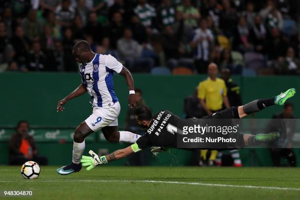 Porto's Cameroonian forward Vincent Aboubakar vies with Sporting's goalkeeper Rui Patricio from Portugal during the Portugal Cup semifinal second leg...