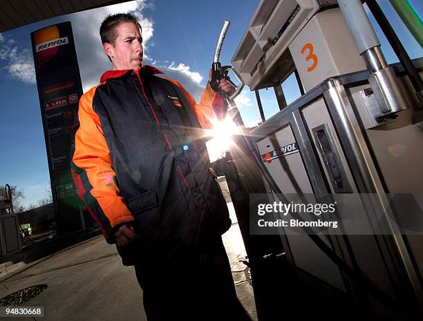 Repsol gas station employee pumps gas in Madrid, Spain, Monday, February 21, 2005. Repsol YPF SA, Europe's fifth-largest oil company, said...
