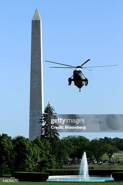 Marine One, carrying U.S. President George W. Bush, takes off near the Washington Monument from the South Lawn of the White House in Washington,...