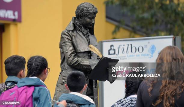 Living statue receives visitors at the XXXI International Book Fair of Bogota on April 18, 2018 in Bogota. Argentina is this year's guest of honour...