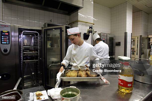 Chefs at Gundel restaurant in Budapest, Hungary, prepare traditional Hungarian dishes in the kitchen of the eatery on Friday, March 3, 2006. Gundel...