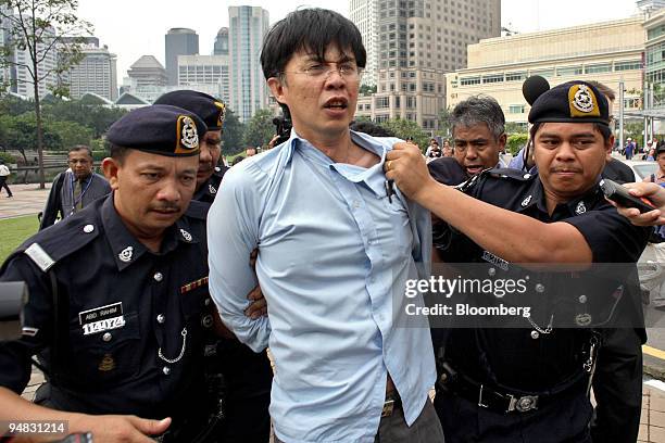 Burmese demonstrators, protesting against ASEAN's stance towards Burma's human rights record, are arrested by Malaysian police outside the Kuala...