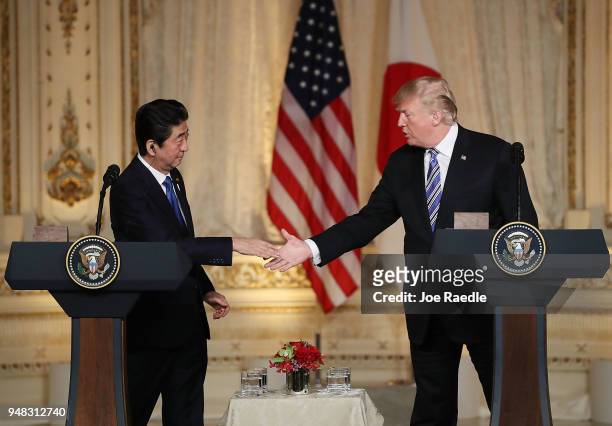 President Donald Trump and Japanese Prime Minister Shinzo Abe shake hands at a news conference at Mar-a-Lago resort on April 18, 2018 in West Palm...
