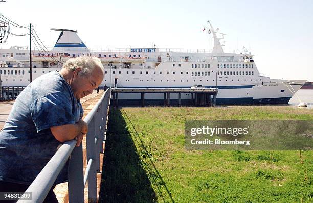 Raymond "Bozo" Couture fisherman and employee of the St. Bernard Parish Council, stands near the cruise ship Scotia Prince, which housed firemen and...