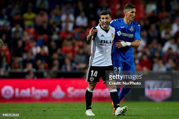 Jose Luis Gaya of Valencia CF reacts next to Faycal Fajr of Getafe CF during the La Liga game between Valencia CF and Getafe CF at Mestalla on April...