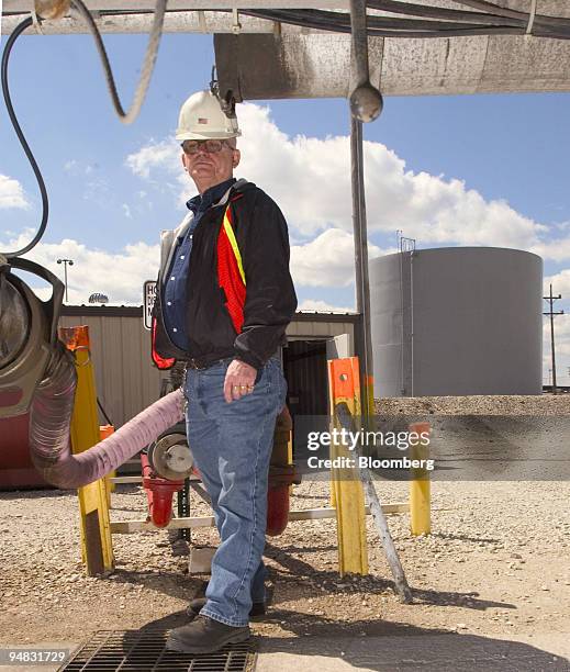 Belt Railway procurement foreman Larry Kincade checks on delivery of a truckload of diesel fuel as it is pumped into a 300,000 gallon storage tank,...