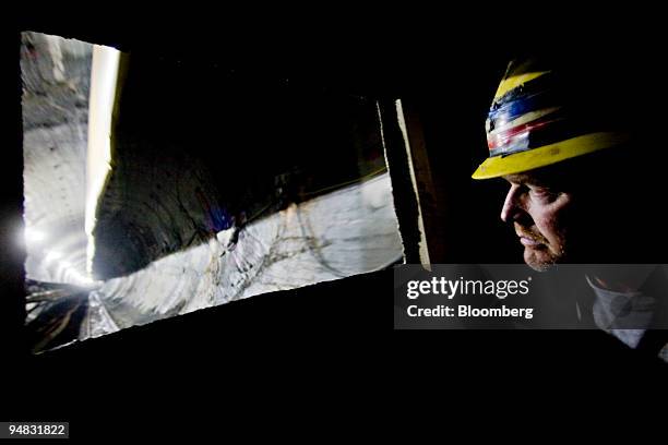 Sandhog Jimmy Diamond watches out the front of a train as it carries members of the media through the eastbound tunnel of the East Side Access...