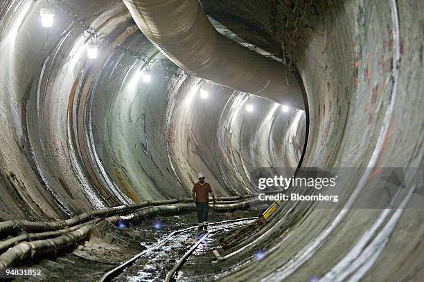 Sandhog walks in the eastbound tunnel of the East Side Access project in New York, U.S., on Thursday, July 17, 2008. The new mile-long tunnel,...