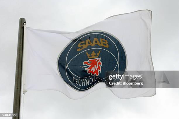 The Saab logo hangs on a flag next to the Saab/Gripen stand during the Farnborough International Airshow in Farnborough, U.K., on Wednesday, July 16,...