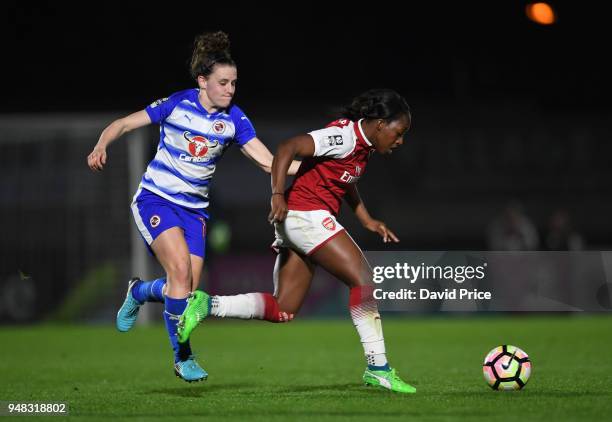 Danielle Carter of Arsenal takes on Lauren Bruton of Reading during the match between Arsenal Women and Reading Women at Meadow Park on April 18,...