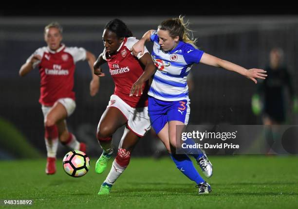 Danielle Carter of Arsenal takes on Harriet Scott of Reading during the match between Arsenal Women and Reading Women at Meadow Park on April 18,...