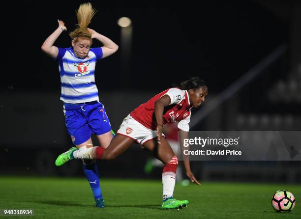 Danielle Carter of Arsenal takes on Rachel Furness of Reading during the match between Arsenal Women and Reading Women at Meadow Park on April 18,...