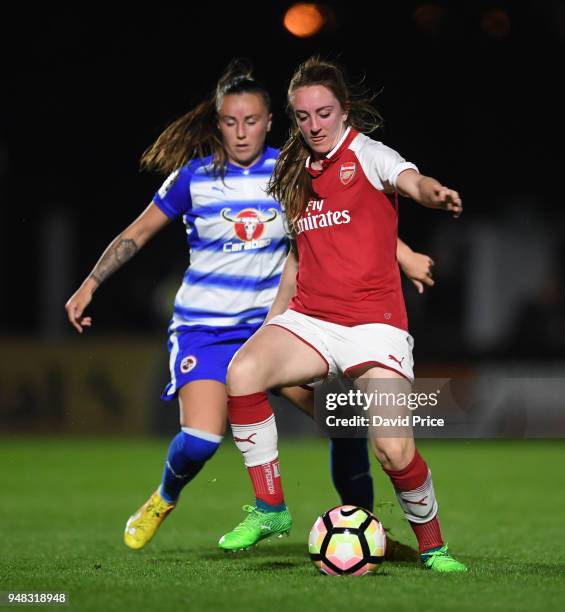 Lisa Evans of Arsenal is challenged by Natasha Harding of Reading during the match between Arsenal Women and Reading Women at Meadow Park on April...