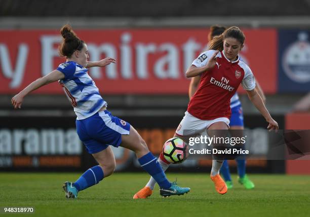 Danielle van de Donk of Arsenal skips past Lauren Bruton of Reading during the match between Arsenal Women and Reading Women at Meadow Park on April...