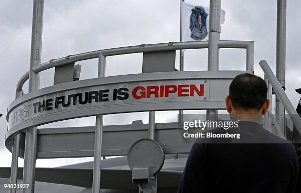 Visitors look at the Saab/Gripen stand at the Farnborough International Airshow in Farnborough, U.K., on Wednesday, July 16, 2008. Bob Kemp, head of...