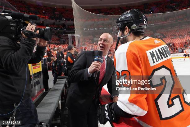 Sports Network broadcaster Pierre McGuire speaks with Brandon Manning of the Philadelphia Flyers during warmups prior to playing the Pittsburgh...