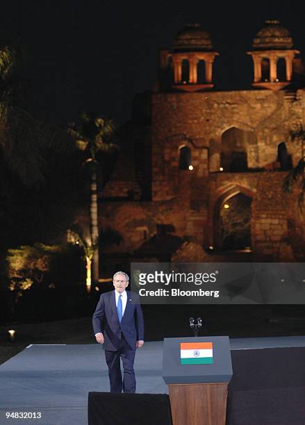 President George Bush strides to the podium before giving a speech at the Purana Qila, or Old Fort, which dates to the 16th century, in New Delhi,...