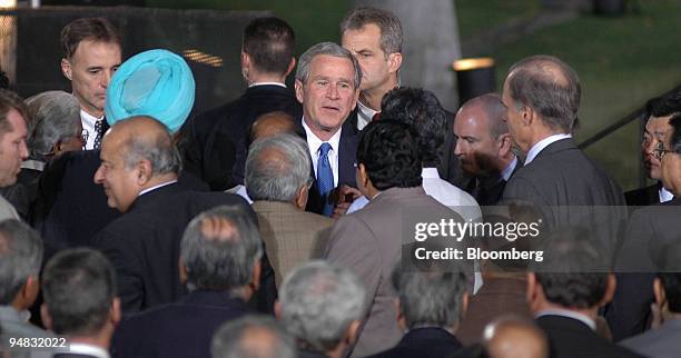 President George Bush greets members of the audience after giving a speech at the Purana Qila, or Old Fort, which dates to the 16th century, in New...