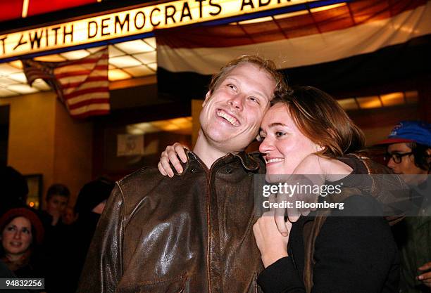 Supporters of Democratic president-elect Barack Obama smile in reaction to the first announcements of Obama winning the U.S. Presidential election,...