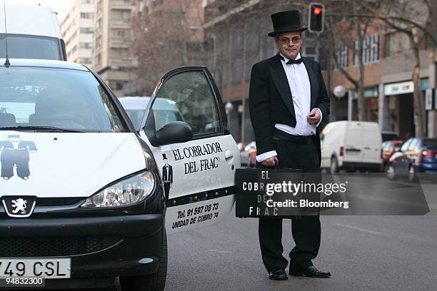 Fermin Puy, who works for Cobrador del Frac, a Madrid-based debt collection poses in Madrid, Spain, Tuesday, March 2, 2006. Spanish debt collectors...