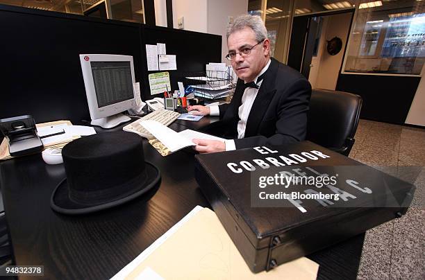 Fermin Puy, who works for Cobrador del Frac, a Madrid-based debt collection poses in his office in Madrid, Spain, Tuesday, March 2, 2006. Spanish...
