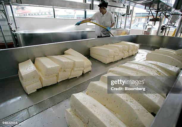 Blocks of cheese curd sit on the premises of Beecher's Homemade Cheese at the Pike Place Market in Seattle, Washington on Thursday, March 2, 2006.