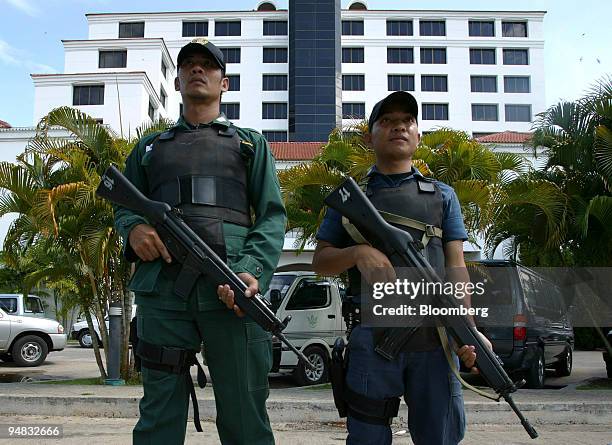 Heavily armed Thai troops stand guard outside a hotel in Hat Yai, Thailand April 30, 2004.