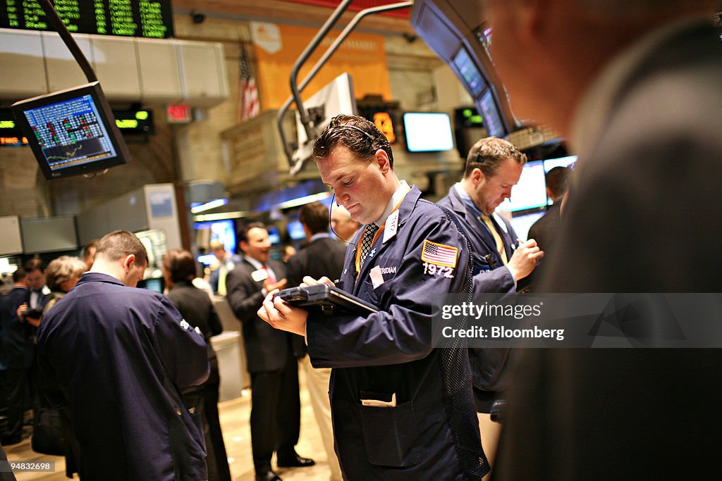 Traders Working Traders work on the floor of the New York Stock Exchange in New York ...