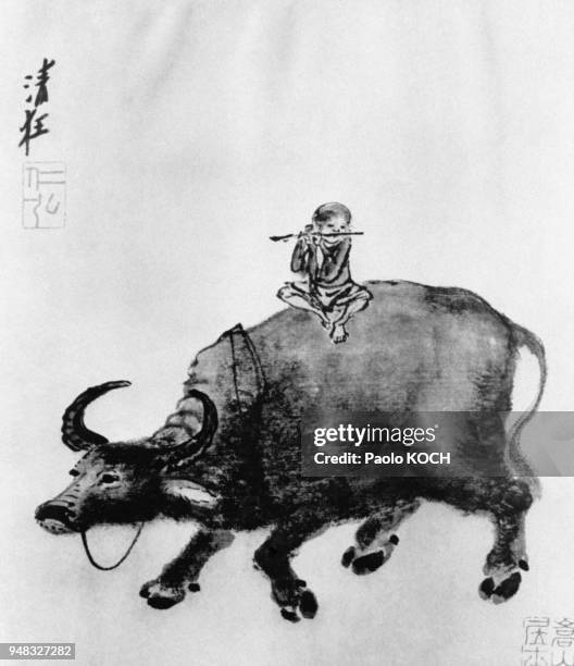 Peinture chinoise datant de la dynastie Song , représentant un berger jouant de la flûte assis sur le dos d'un buffle, au musée de Shanghaï, en Chine...