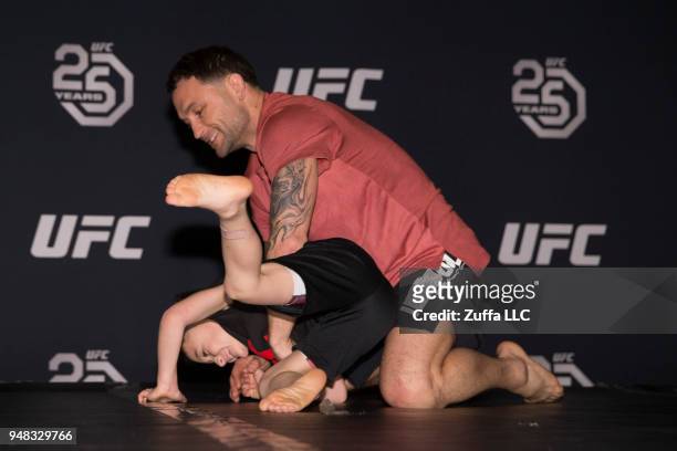 Frankie Edgar participates in an open workout with his son Santino Edgar at Atlantic City Boardwalk Hall on April 18, 2018 in Atlantic City, New...