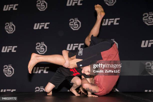 Frankie Edgar participates in an open workout with his son Santino Edgar at Atlantic City Boardwalk Hall on April 18, 2018 in Atlantic City, New...