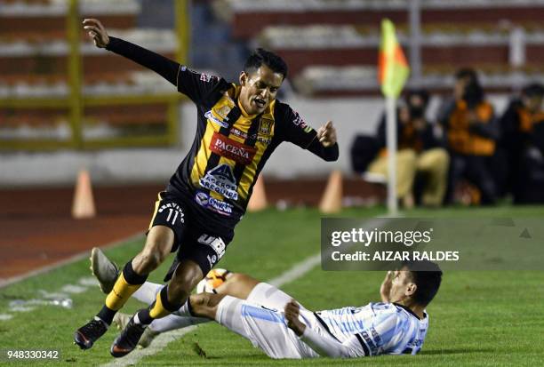Bolivia's The Strongest footballer Jhasmani Campos , vies for the ball with Gervasio Daniel Nunez of Argentina's Atletico Tucuman, during their Copa...