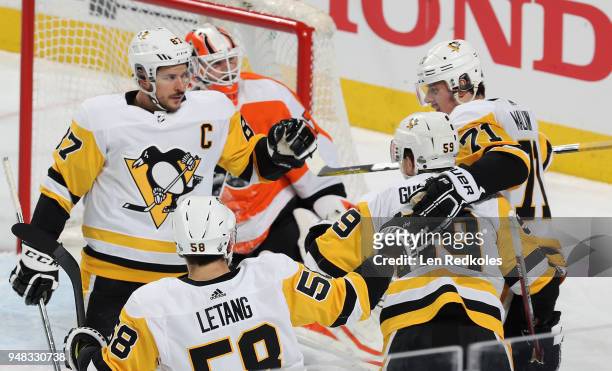 Evgeni Malkin of the Pittsburgh Penguins celebrates his first period power-play goal against Brian Elliott of the Philadelphia Flyers with Sidney...