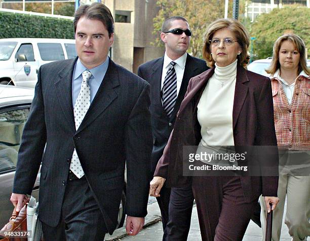 Evelyn Irvin-Plunkett, second from right, arrives at the Federal Courthouse in downtown Houston, Texas Monday, December 12, 2005 with Leslie...