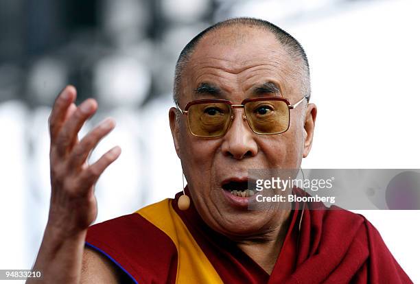 Tenzin Gyatso, the 14th Dalai Lama, gestures while speaking in Berlin, Germany, on Monday, May 19, 2008. German Development Minister Heidemarie...