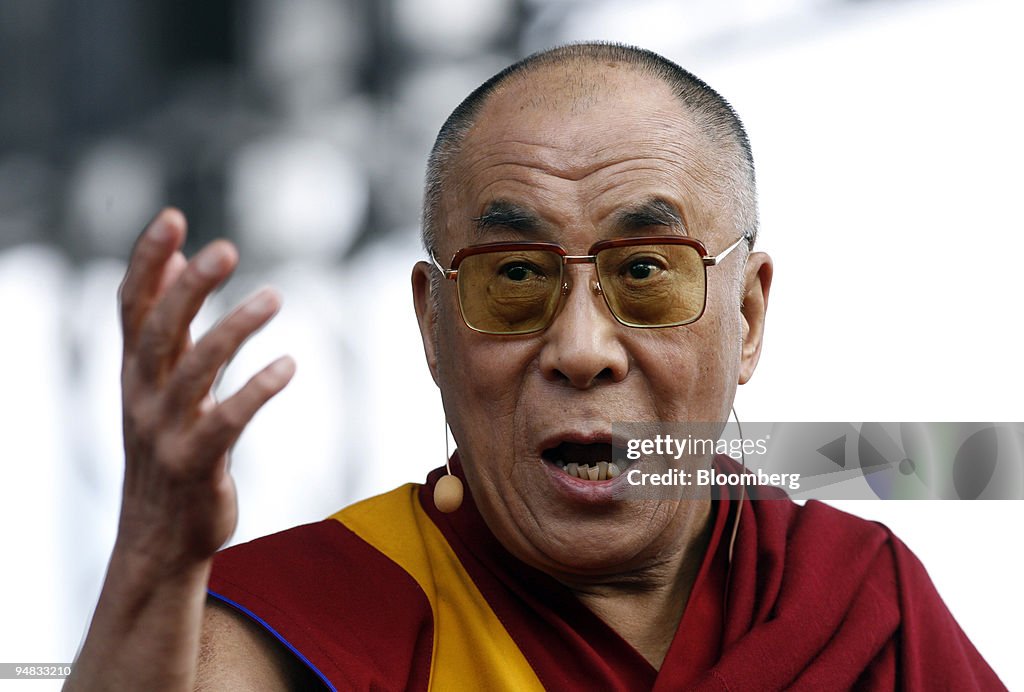 Tenzin Gyatso, the 14th Dalai Lama, gestures while speaking