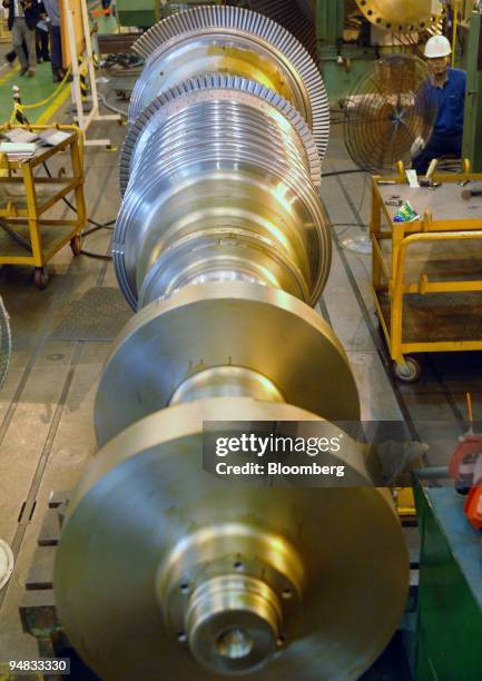 An employee works on a turbine for a generator plant at Doosan Heavy Industries & Construction Co.'s Changwon plant in Changwon, South Korea, on...
