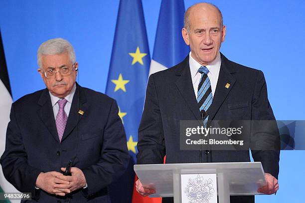 Ehud Olmert, Israel's prime minister, right, speaks as Mahmoud Abbas, president of the Palestinian Authority, listens at the Elysee Palace in Paris,...