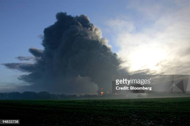 Smoke and flames fill the sky from the Buncefield Fuel Depot, in Hemel Hempstead, England, Sunday, December 11, 2005. The depot operated by Total SA...