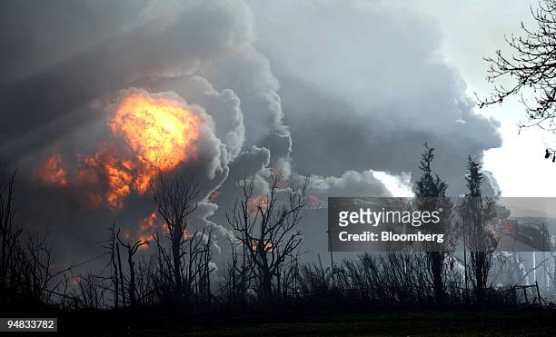Fires can be seen burning at the oil depot in Hemel Hempstead, Hertfordshire, England on Sunday, December 11, 2005. The U.K.'s fifth-largest oil...