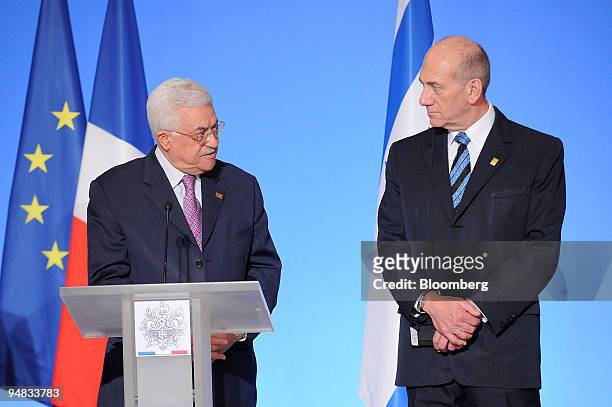 Mahmoud Abbas, president of the Palestinian Authority, left, speaks as Ehud Olmert, Israel's prime minister, listens at the Elysee Palace in Paris,...