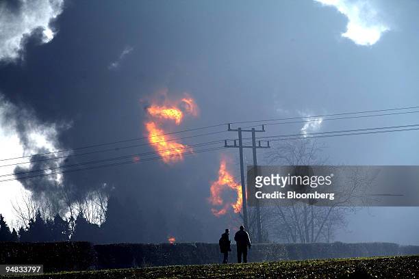 Fires can be seen burning at the oil depot in Hemel Hempstead, Hertfordshire, England on Sunday, December 11, 2005. The U.K.'s fifth-largest oil...
