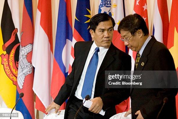 Nyan Win, Myanmar's minister of foreign affairs, left, takes his seat next to Pham Gia Khiem, Vietnam's deputy prime and foreign affairs minister,...